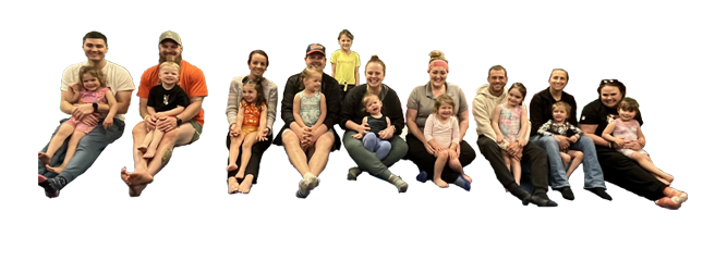 01 (2) A group of people sitting on the ground with their children.