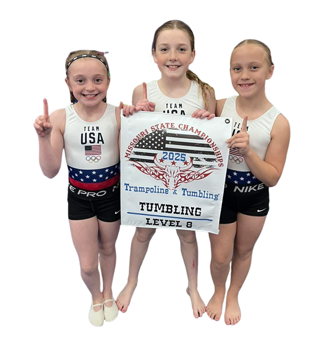 Three young girls holding a sign in front of them.
