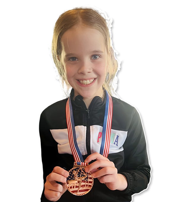 17 A young girl holding onto two medals
